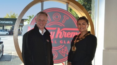 Jamie Dunning with Mayor of Enfield Suna Hurman at the 20-year anniversary celebration. Credit: Krispy Kreme